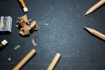 Pencil on black background.