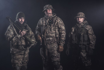 Fototapeta premium Elite squad soldiers with weapons and ammunition