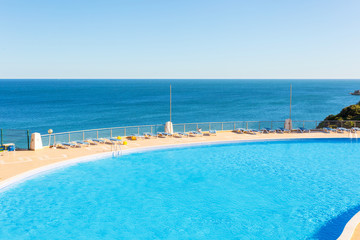 Fototapeta na wymiar Swimming pool by the sea 