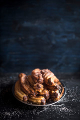 Traditional Mexican churros stuffed with melted chocolate,selective focus and blank space