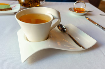 tea time. hot herbal tea in a white Cup