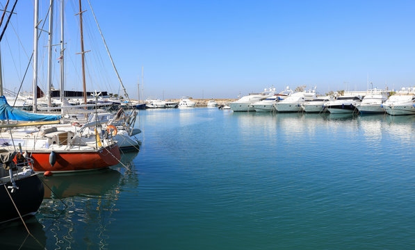 Summer time beautiful sailboats and yachts moored in Glyfada port, Athens, Greece.