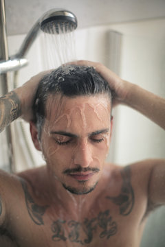 Attractive man having a shower