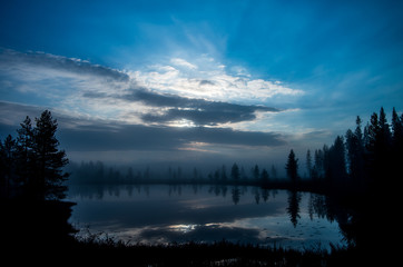 Serene, blue moment over a small lake in Lapland, Finland