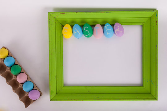 Easter eggs and a green picture frame