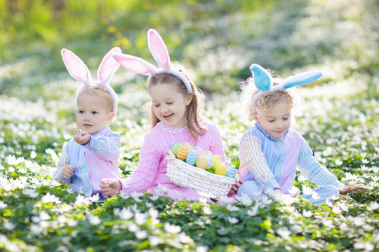 Kids with bunny ears on Easter egg hunt.