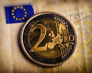 coin of two euros. Coin on a blurred background coin denomination of two euros. Currency of the...