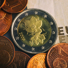 coin of two euros. Coin on a blurred background coin denomination of two euros. Currency of the...