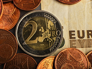 coin of two euros. Coin on a blurred background coin denomination of two euros. Currency of the...