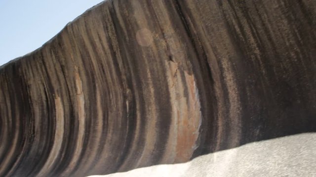 Front view of scenic Wave Rock a natural rock formation shaped like a high breaking ocean wave in Hyden, Western Australia. Wave Rock is part of Hyden Rock in Hyden Wildlife Park, Australia.
