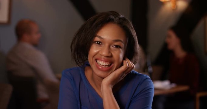4K Young woman making small talk on a date in restaurant. As seen from her date's point of view