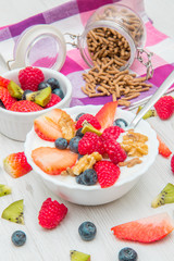 breakfast with yogurt,strawberry rasperry and cereals