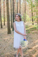 Portrait of a woman in wedding dress with white flowers. the bride holding a bouquet