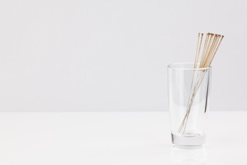 Silver needles for traditional Chinese acupuncture medicine. There is room for your text or sign.