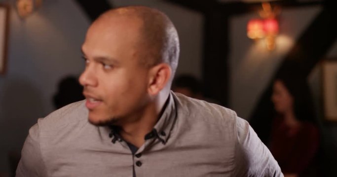 4K Young man making small talk on a date in restaurant. As seen from his date's point of view