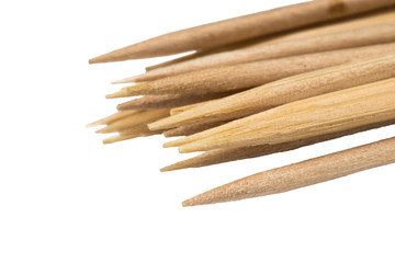 Bamboo wooden toothpicks on white background Close-up