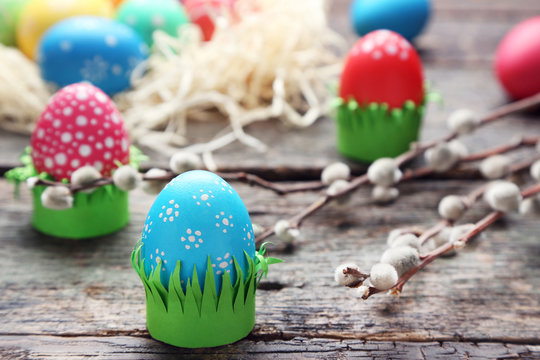 Colorful easter eggs on wooden table