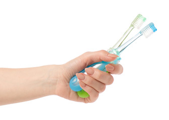 Two travel toothbrush in hand