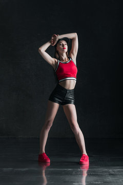 Young beautiful female dancer is posing in the studio © Alexander Y