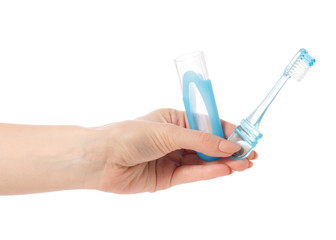 Travel blue toothbrush in hand