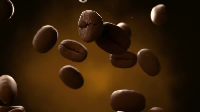 3d closeup animation of roasted coffee beans slowly falling. Seamless looping footage