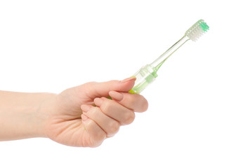 Travel green toothbrush in hand