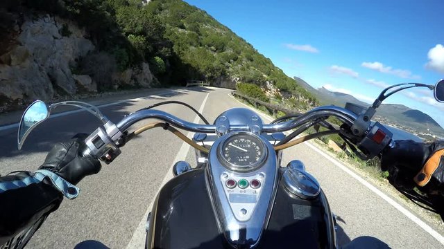 Classic motorcycle riding in Capo Caccia. Sardinia, Italy