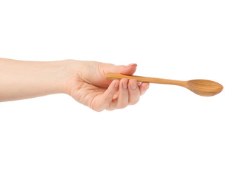 Wooden small spoon in hand