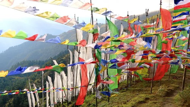 Buddhist prayer flags blowing In the wind. Shot in Bhutan.
