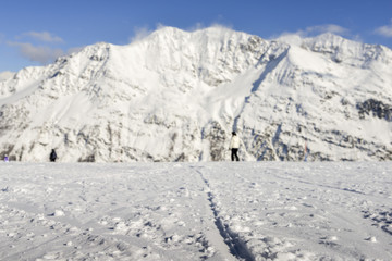 Obraz premium Selective focus of snowy slope in the famous and scenic ski resort of La Thuile, Aosta Valley, Italy