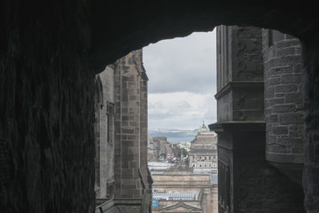 frame of the city of edinburgh from a little street in the city centre.