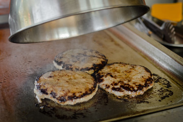 Burger on a stove background. Delicious hamburger cheeseburger. Healthy fresh food cooking eating