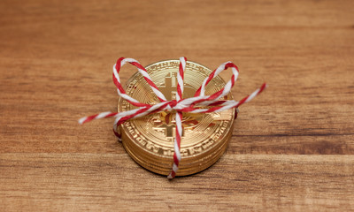 golden bitcoin coins wrapped as gift