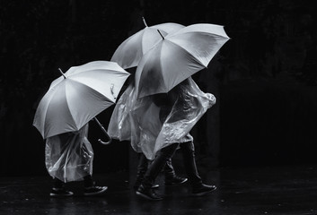 People under umbrellas