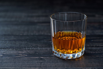 Whiskey on a  black wooden table