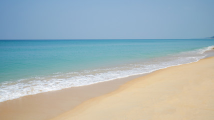 Fototapeta na wymiar Beach and sand with water wave. Sea foam.