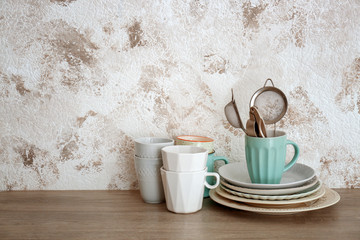 Set of cooking utensils and dishware on table