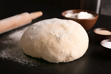 Raw dough on kitchen table