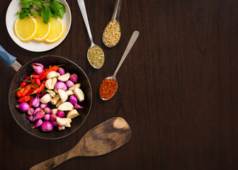 Raw ingredients - herbs and spices lay flat image on wooden table top