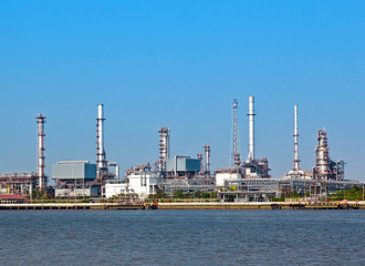 Oil and gas refinery with reflection in water - Petrochemical factory