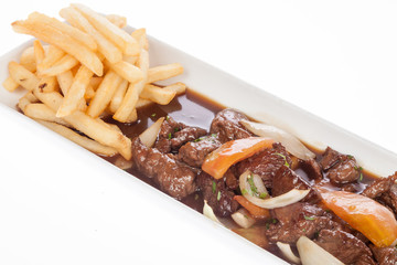 Beef goulash with vegetables and french fries