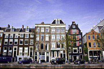 Fototapeta na wymiar Amsterdam Canal Multicolored Row Houses Cityscape