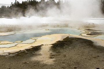 Steaming spring rock formation in Upper Geyser Basin, Yellowstone National Park