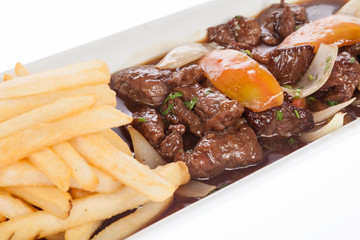 Beef goulash with vegetables and french fries