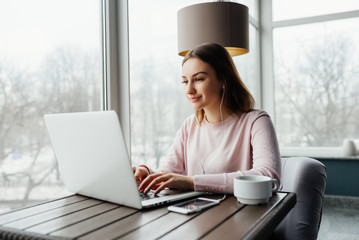 Girl use Laptop huge Loft Studio.Student Researching Process Work.Young Business Woman Working Creative Startup modern Office.Analyze market stock,new strategy. Horizontal