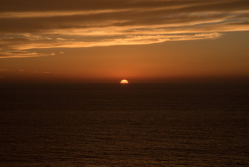 Halfway sunset on horizon