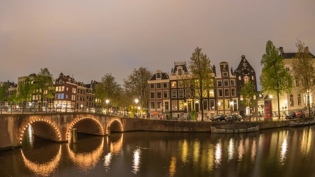 Amsterdam city skyline day to night timelapse at canal waterfront, Amsterdam, Netherlands 4K Time Lapse