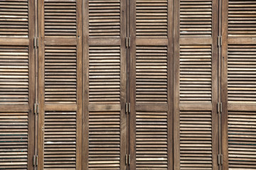 Background latticed wooden doors texture in the tropical house