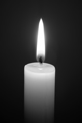 Emergency lighting, candle on black background