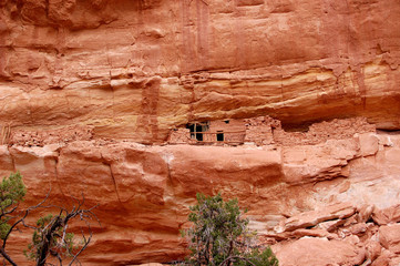 Ancient Anizazi ruins perched on canyon wall in southern Utah Canyon country.